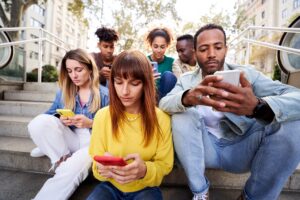 Group of young people on their phones